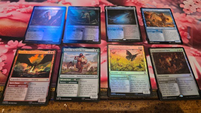 Adventurer cards including Smaug the Great Calamity, Beorn, Reluctant Host, Velvetwing Butterflies, and An Unexpected Party. Each card has it's effect box split in two, with the left side of the card detailing the spell that could be cast along with it's cost, and the right side showing the usual creature's effect.