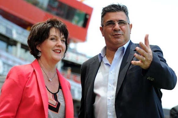Former Liberal and LNP member for Currumbin, Jann Stuckey, pictured with then-AFL CEO Andrew Demetriou in 2013 while she was Tourism Minister in the Newman government.