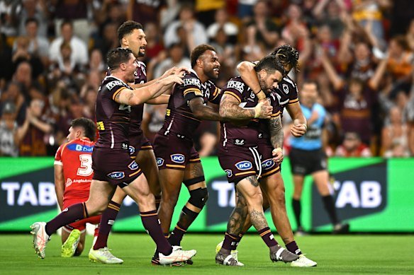 Adam Reynolds celebrates a try against the Dolphins in March.