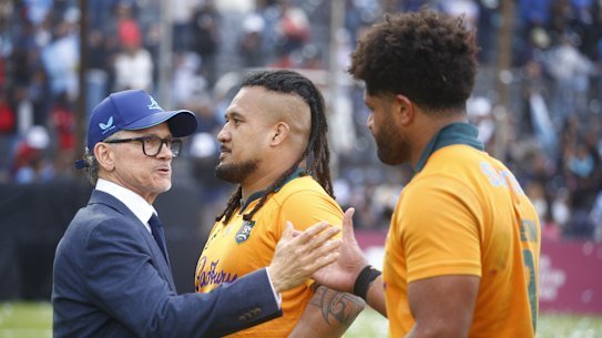 Les Kiss congratulates Brandon Paenga-Amosa and Rob Valetini following the win over Argentina.