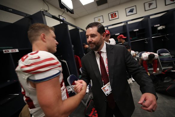 Jed York with San Francisco quarterback Christian McCaffrey last season. 