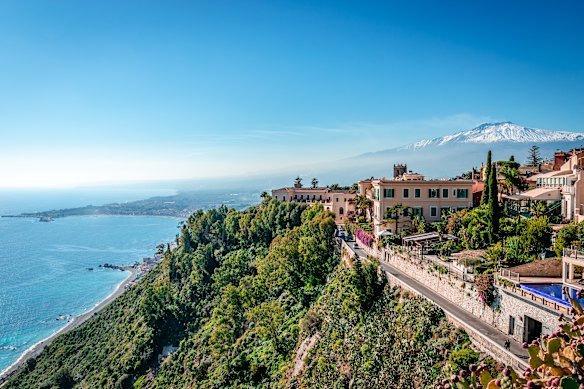 Taormina, Mount Etna and the Ionian Sea from Piazza IX Aprile.