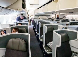 American Airlines is reversing its bet against seatback screens