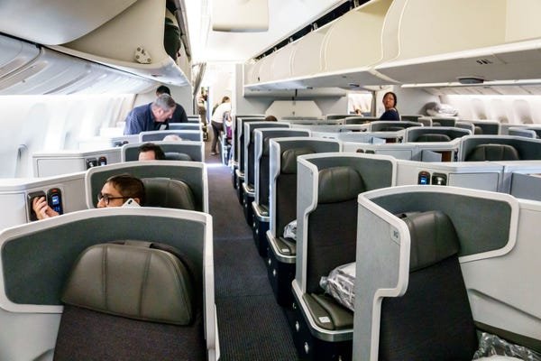 American Airlines is reversing its bet against seatback screens