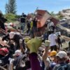 Anguish of Colombian brother at rubble of building being searched for earthquake survivors