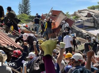 Anguish of Colombian brother at rubble of building being searched for earthquake survivors