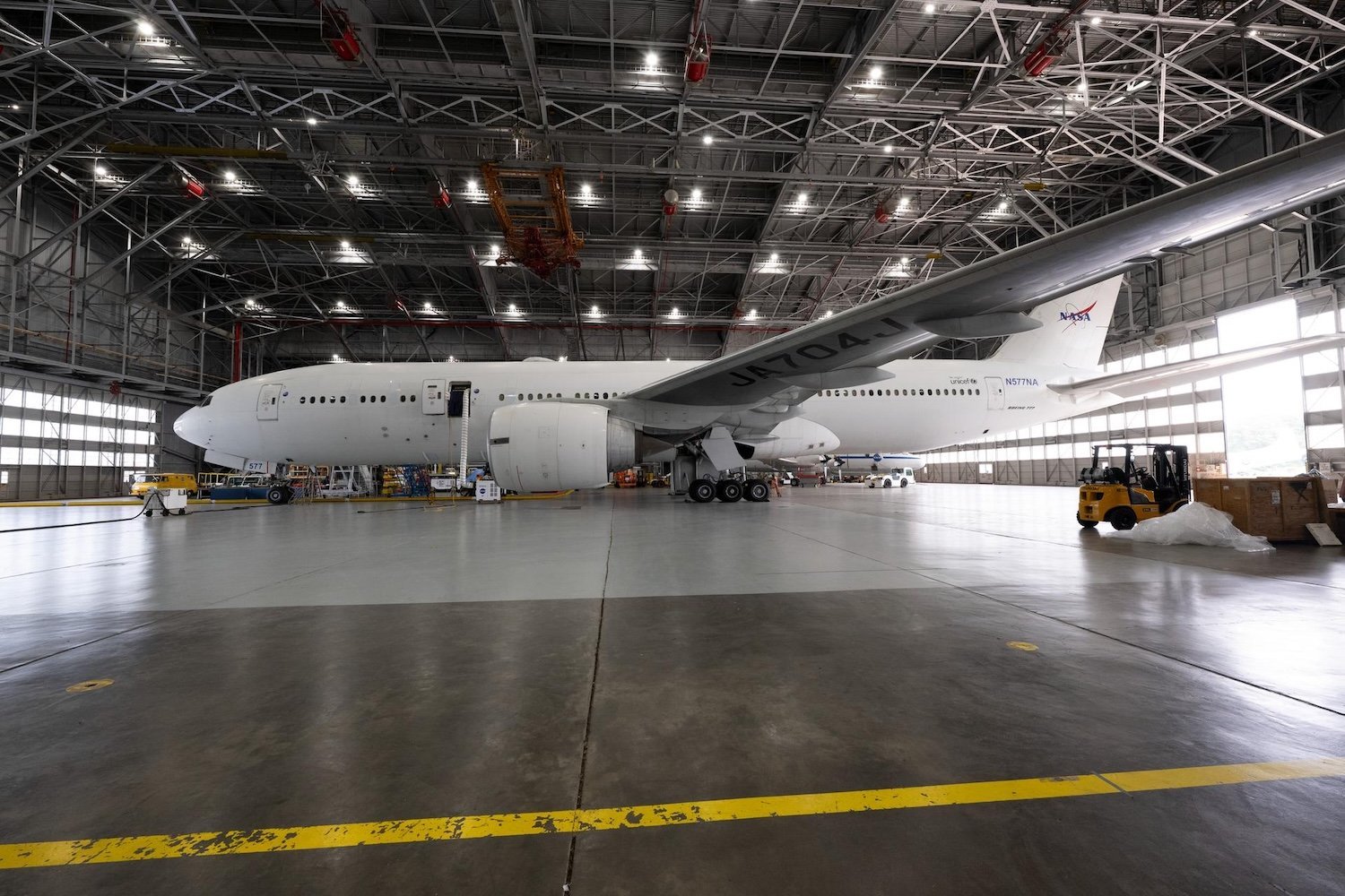 Before Langley's B777 aircraft departed Langley Research Center to received its NASA livery (paint job), it received ground maintenance in the hangar on center. Photo Credit NASA/Ryan Hill
