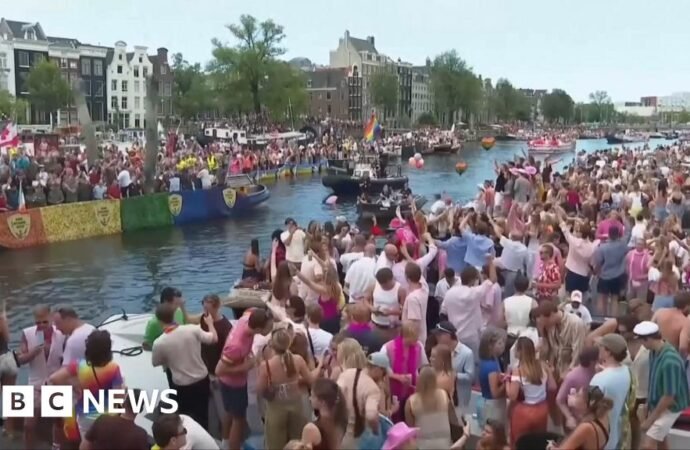 Crowds line Amsterdam’s canals for Pride boat parade