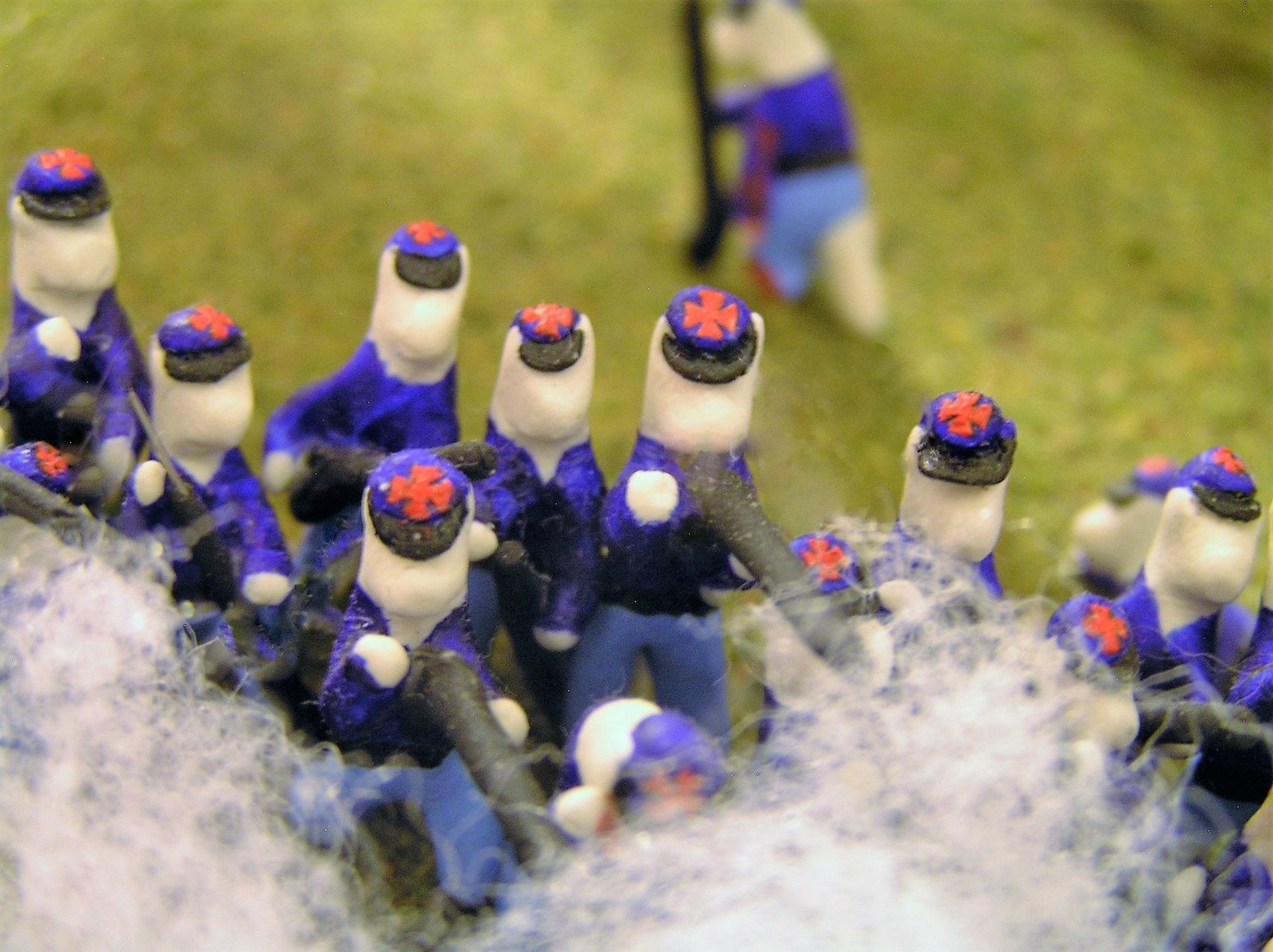 cats made out of clay wearing union army uniforms with a red cross on the top of their hats