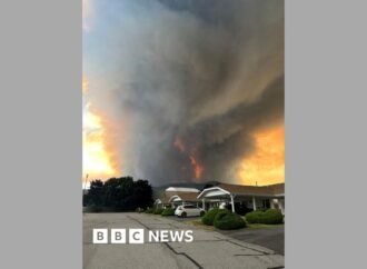 Fast-moving Canada wildfire doubles in size forcing thousands to flee homes