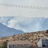 Firefighters are trying to stop a fast-moving Nevada wildfire from spreading to homes in Reno