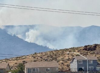 Firefighters are trying to stop a fast-moving Nevada wildfire from spreading to homes in Reno