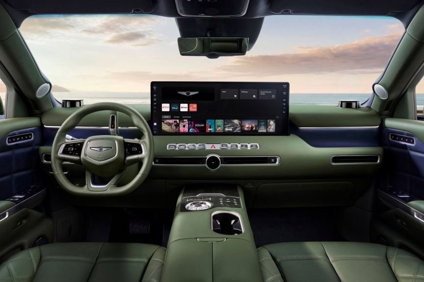 Genesis GV90's dashboard with large center screen and green upholstery
