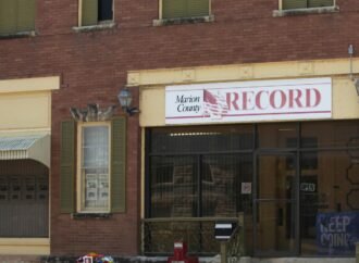 Kansas town will pay $850K to end reporter’s lawsuit over 2023