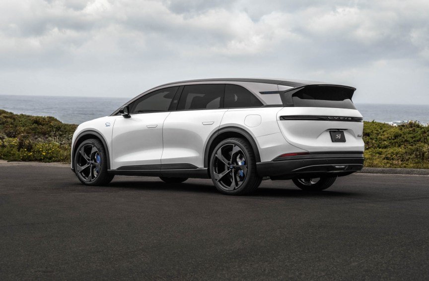 Lucid Gravity GT-S, rear view, parked near the waterfront