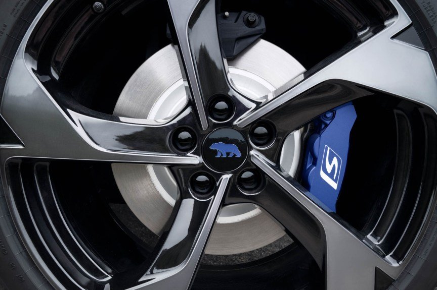 Close up of GT-S sport wheel with blue Lucid Bear logo and brake caliper.