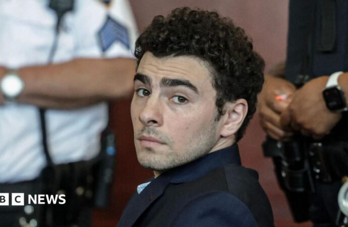 Luigi Mangione admits killing healthcare CEO and pleads guilty to federal charges