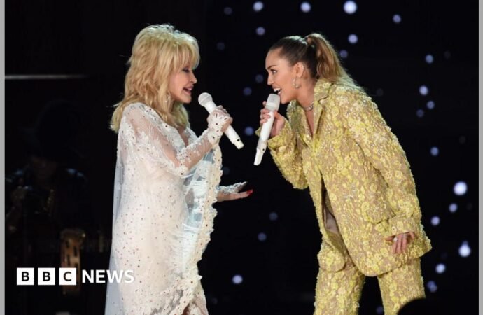 Miley Cyrus remembers godmother Dolly Parton as an ‘angel by my side’