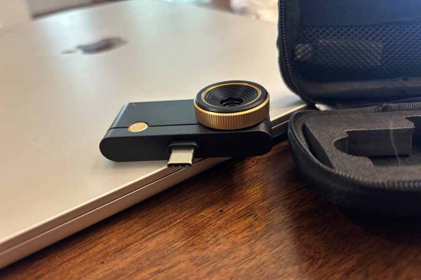 Thermal detector on laptop beside case.