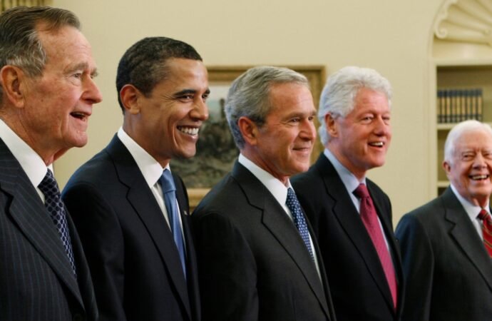 Trump goes unmentioned but not ignored as Clinton, Bush and Obama step up as essayists on presidents