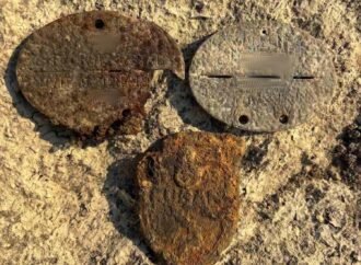 WWII motorcycle and soldiers emerge from river muck in Hungary