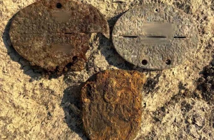 WWII motorcycle and soldiers emerge from river muck in Hungary