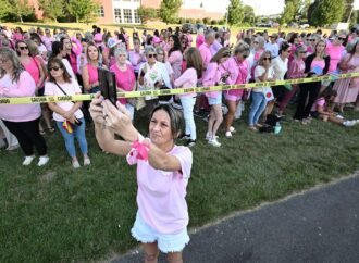 Women in pink rally in support of Lindsay Clancy who is on trial for killing 3 children