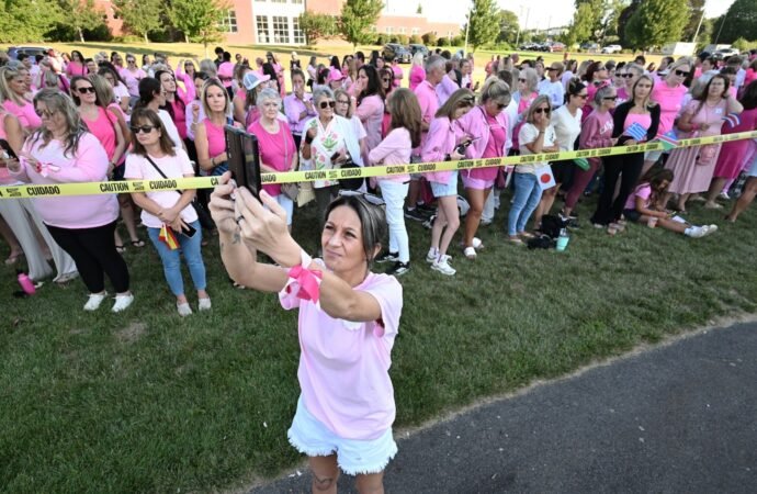 Women in pink rally in support of Lindsay Clancy who is on trial for killing 3 children