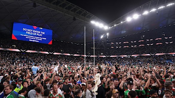 Fans flocked onto the field after Alex Johnston’s record-breaking try against the Roosters in March.
