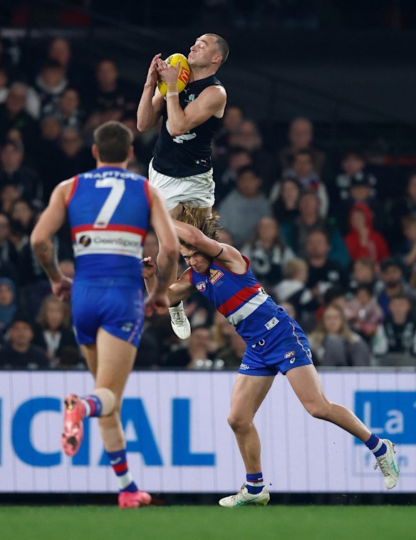 Will Hayward soared onto Bulldog Ryley Sanders’ shoulders.