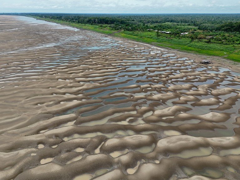 Aerial view of a beach that has formed on the bank of the Solimoes River due to historic drought in Brazil.