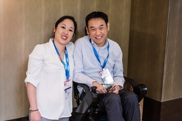 Monkol Lek and his wife Angela Lek backstage at a conference.