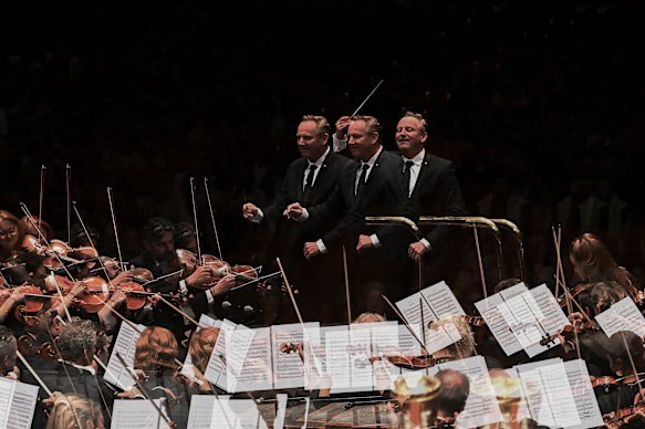 Conductor Alexander Briger in full flight as he conducts the Australian World Orchestra. 