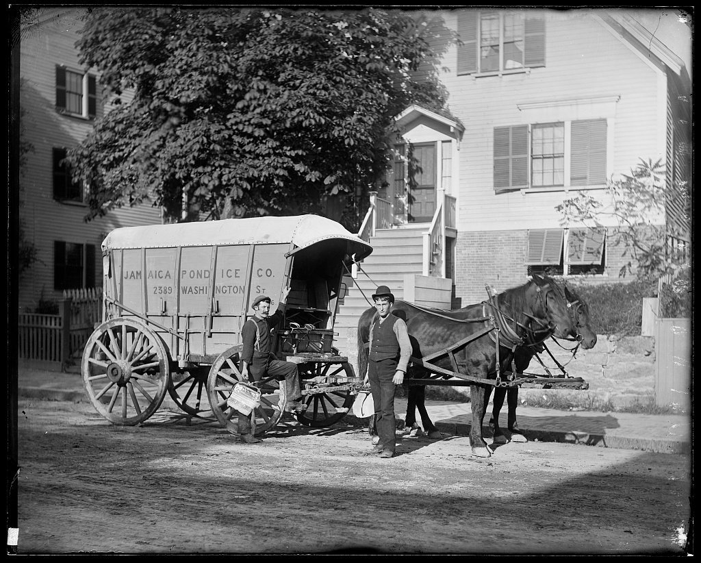 Men delivering ice on horse-drawn wagons.