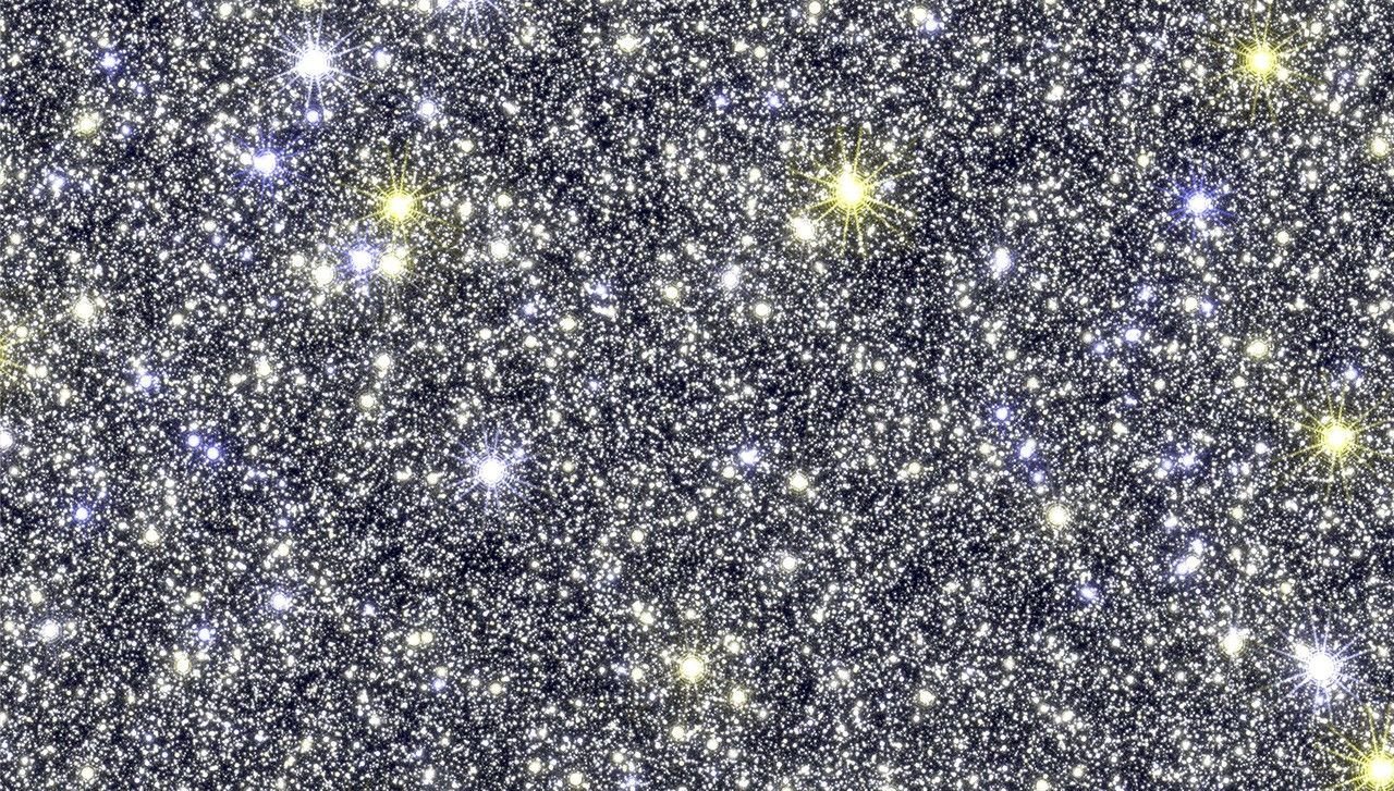 a simulated image of the center of our galazy. it is glittery and bright