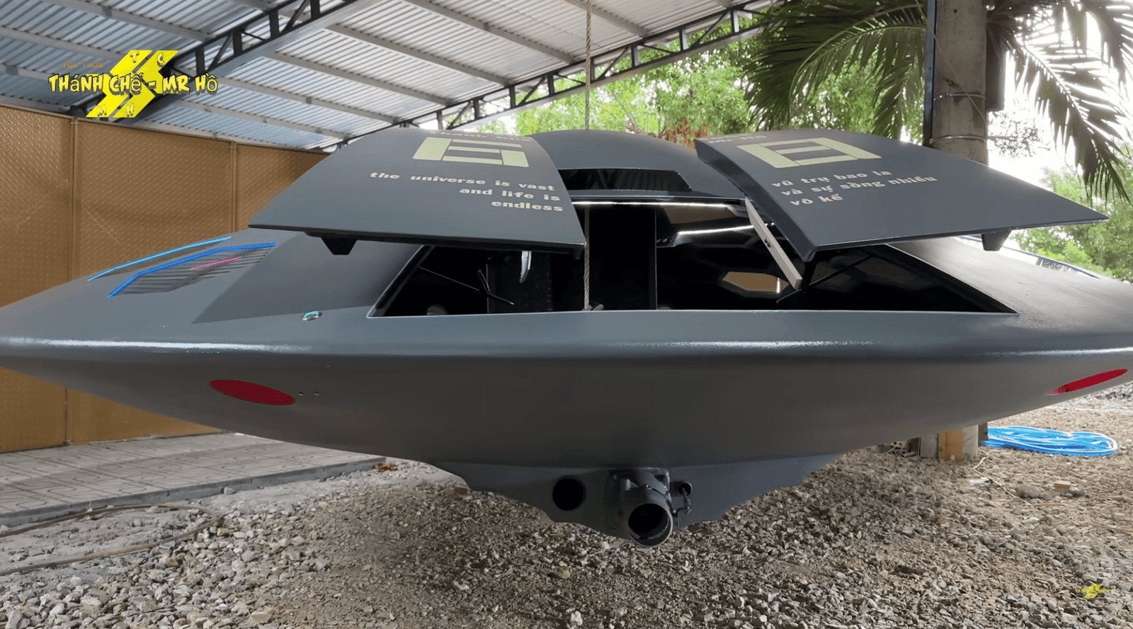 a flying saucer with a retractable door