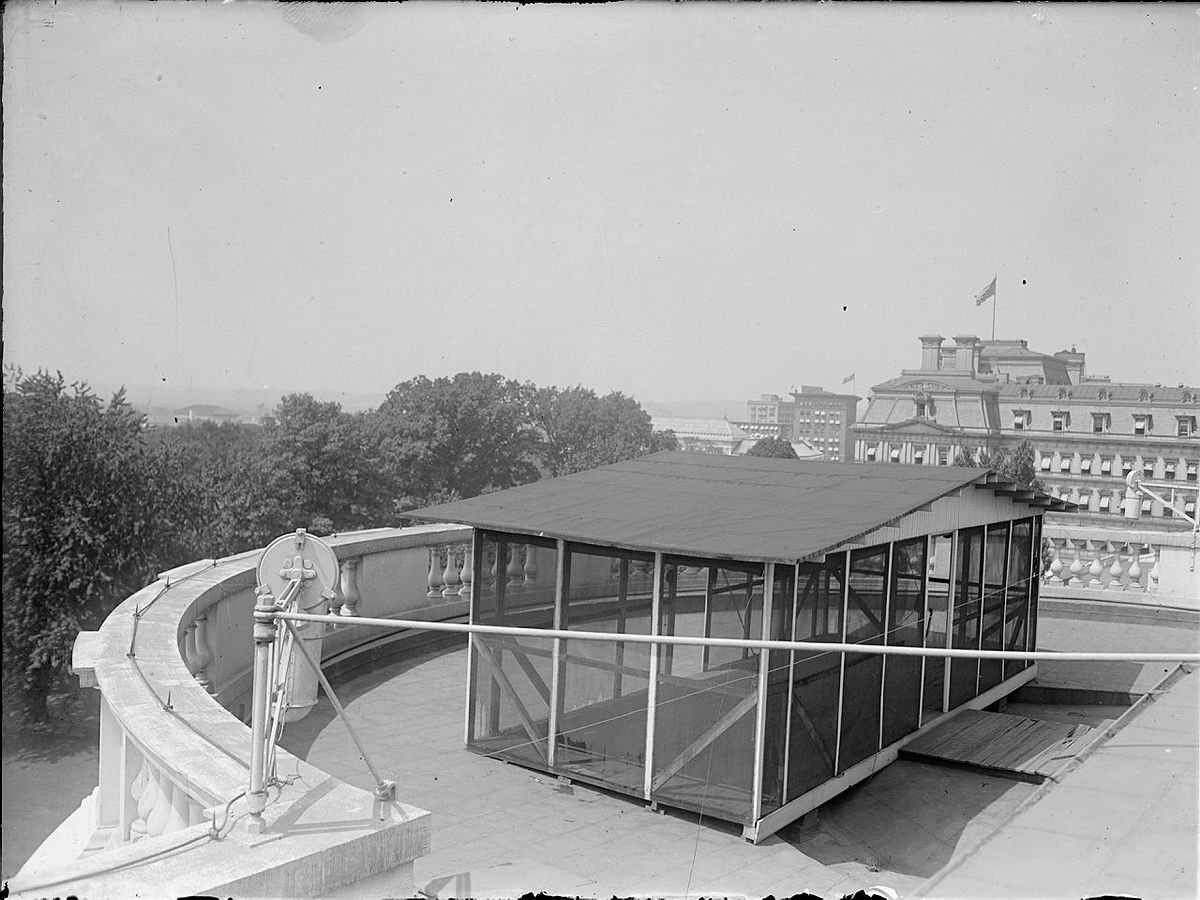 open air screen-in room on top of white house.