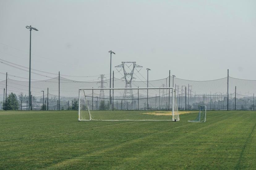 A soccer goal post at Hal and Berni Hanson Regional Park with transmission towers in the background.