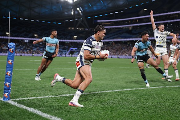 North Queensland’s Braidon Burns scores in front of plenty of empty seats at Allianz Stadium.