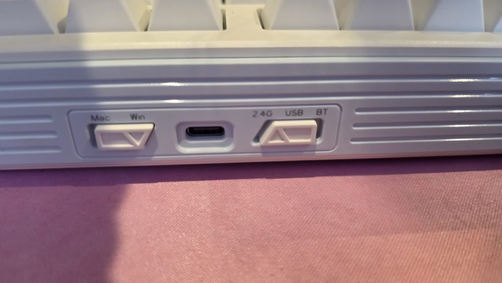 Back side of the keyboard showing the USB plug, and three modes of connectivity: 2.4G, USB, BT, and Mac/Windows switch.