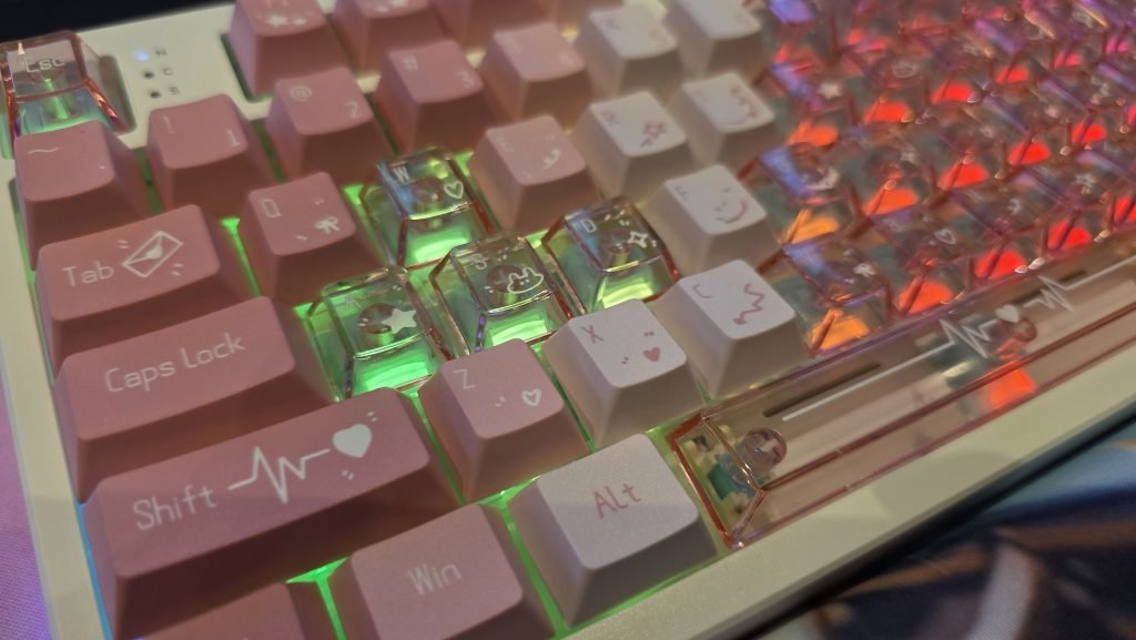 Close up of the right hand side of the keyboard showing a green light coming through only the translucent keys.