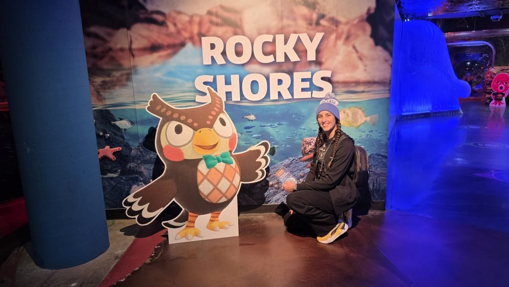 Me sitting next to Blithers with the words "Rocky Shores" in the background.