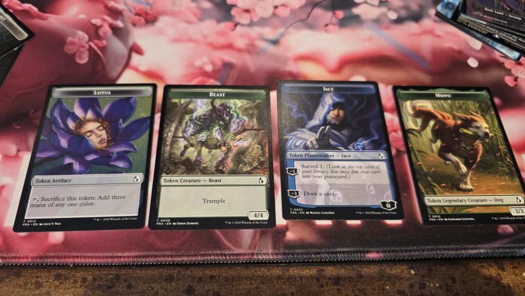 Four token cards; a Lotus token artifact, a token creature, a Jace token planeswalker, and a token creature legendary dog.