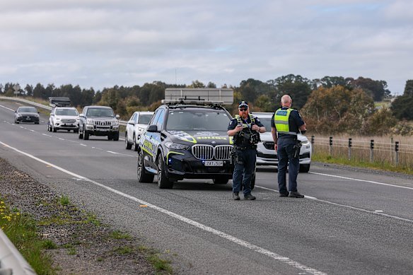 Police assessing the crash scene on Monday.