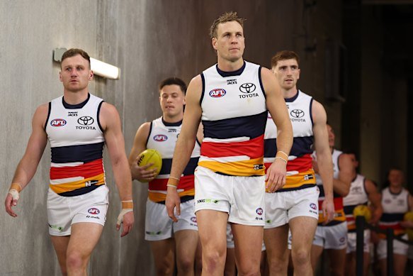 Adelaide captain Jordan Dawson leads his side out during a game in August.