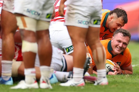 Angus Bell of the Wallabies scores a try against Japan.