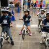 A childhood rite moves indoors as kindergartners learn to ride bikes in school gyms