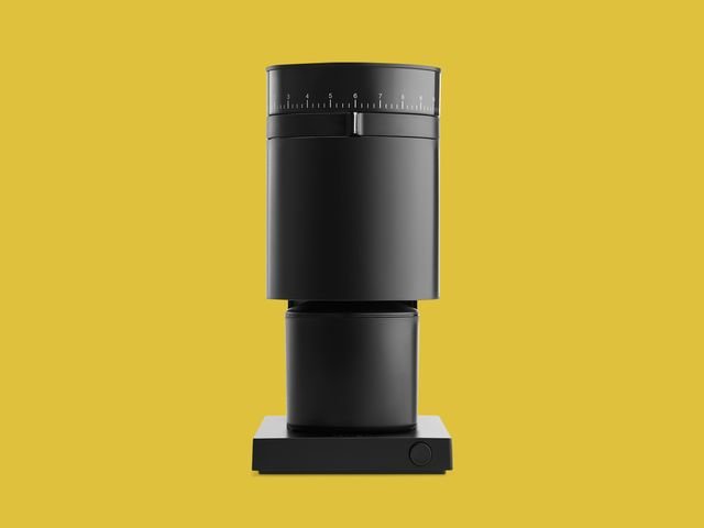 Fellow Opus coffee grinder on yellow backdrop