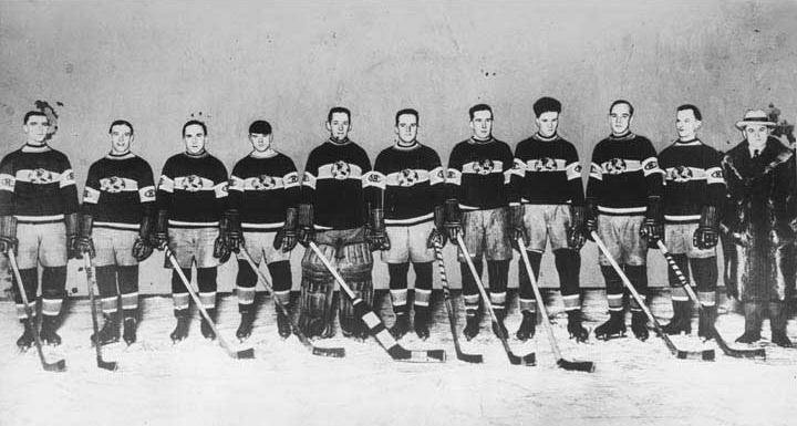 Vintage photograph of hockey players on ice.