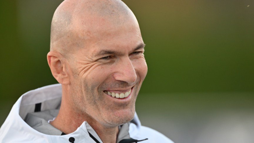 France snational soccer team head coach Zinedine Zidane smiling.
